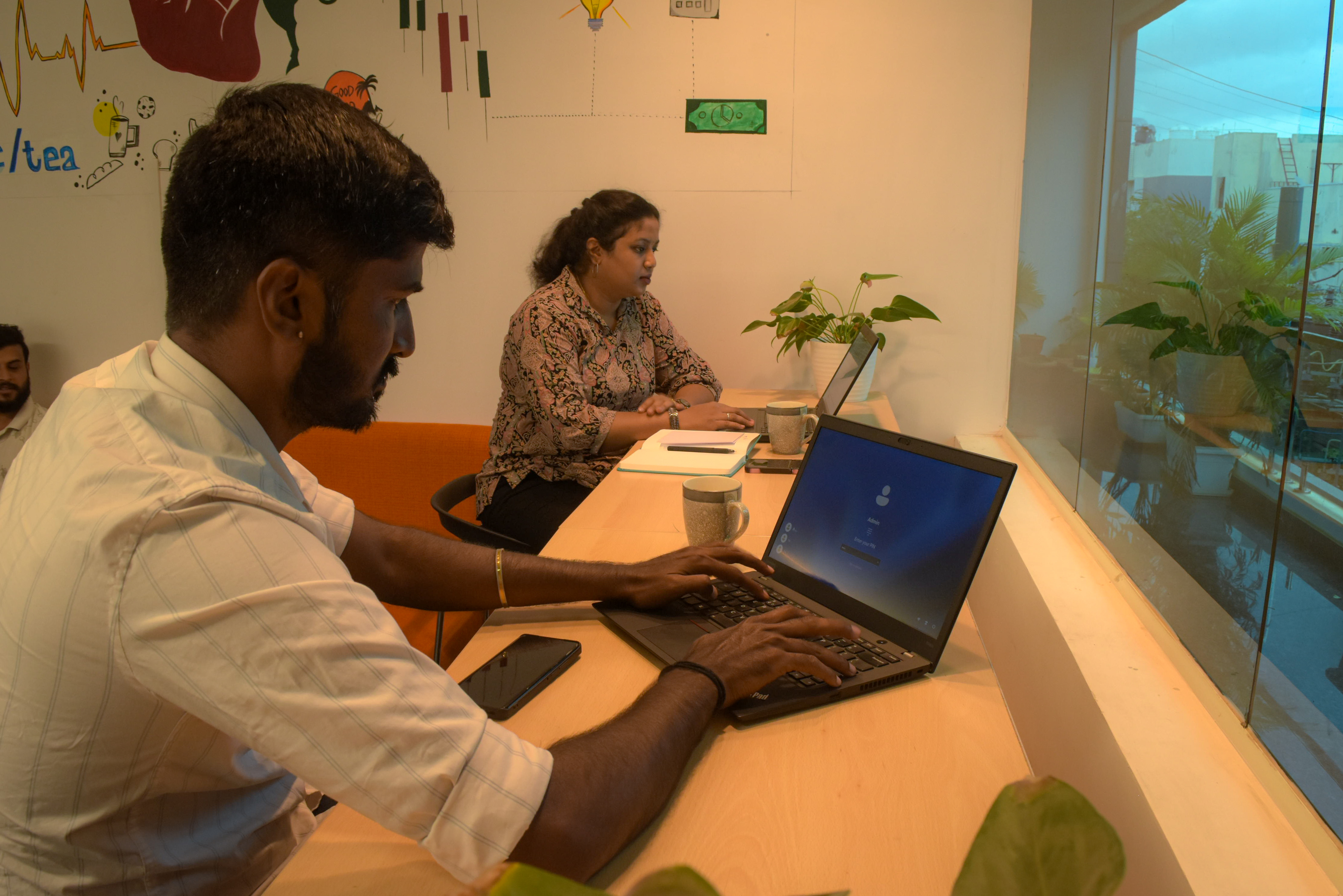 Professionals using high-speed internet in a collaborative office